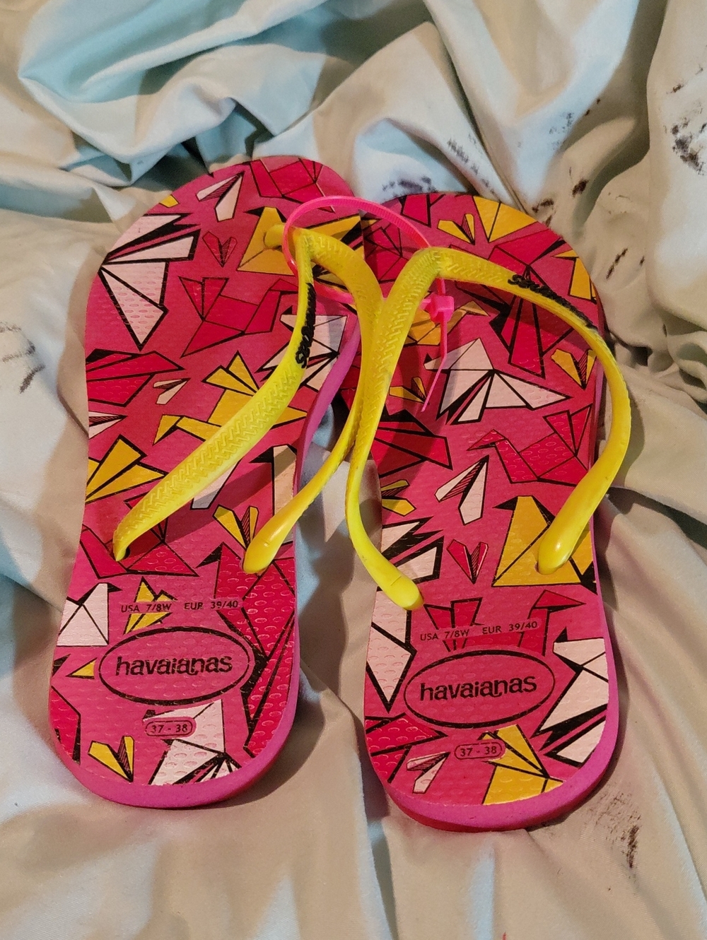 Havaianas Pink Flip Flops with Yellow Straps and Geometric Print